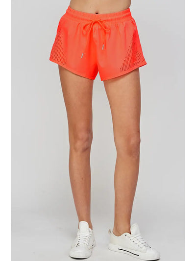 Pantalones cortos para correr En Creme con detalles en triángulo