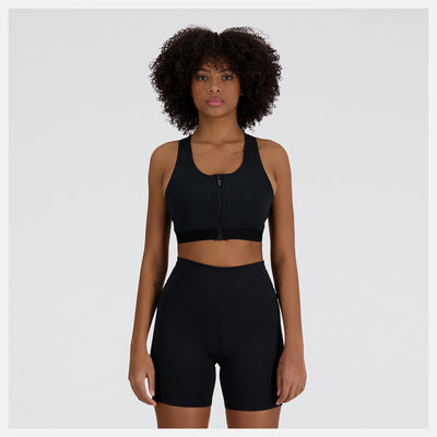 Sujetador deportivo New Balance Sleek de sujeción media con bolsillo y cremallera frontal - Negro - MUJER (WB41047)